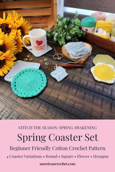 Pinterest style product graphic for the Spring Coaster Set by Mistie Bush of American Crochet. The top portion shows a styled flat lay on a dark wood surface with four crocheted coaster designs — a large mint green round coaster with lace border, a gray square coaster, a small gray square coaster in progress, and a yellow flower coaster with white border — alongside an American Crochet branded mug, wooden yarn bowl with pale blue cotton yarn, decorative scissors, colorful stitch markers, a dark wooden crochet hook, yellow sunflowers, eucalyptus, and a wood tray with yarn cakes in mint, pink, yellow, and sage green. The bottom pink text block reads: Stitch the Season: Spring Awakening — Spring Coaster Set — Beginner Friendly Cotton Crochet Pattern — 4 Coaster Variations: Round, Square, Flower, Hexagon — americancrochet.com