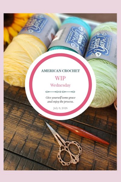 American Crochet WIP Wednesday Pinterest image for July 8, 2026 — three skeins of Hobby Lobby I Love This Yarn in soft yellow, teal, and mint green displayed with ornate scissors and a wooden crochet hook on a dark wood surface, overlaid with a pink circle graphic reading "Give yourself some grace and enjoy the process."