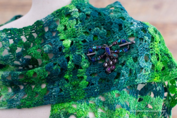 Emerald City Scarf — a long, lacy handspun crochet scarf draped softly, by American Crochet